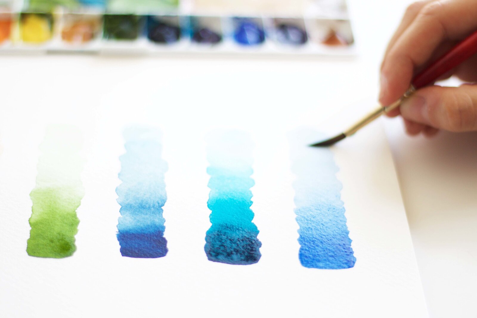 Jenna Rainey with a blue watercolor value study